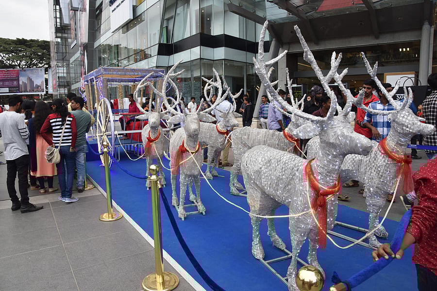 Santa Chariot is placed in front of Form Mall, on the occasion of Christmas at Bengaluru on Monday. Photo by S K Dinesh