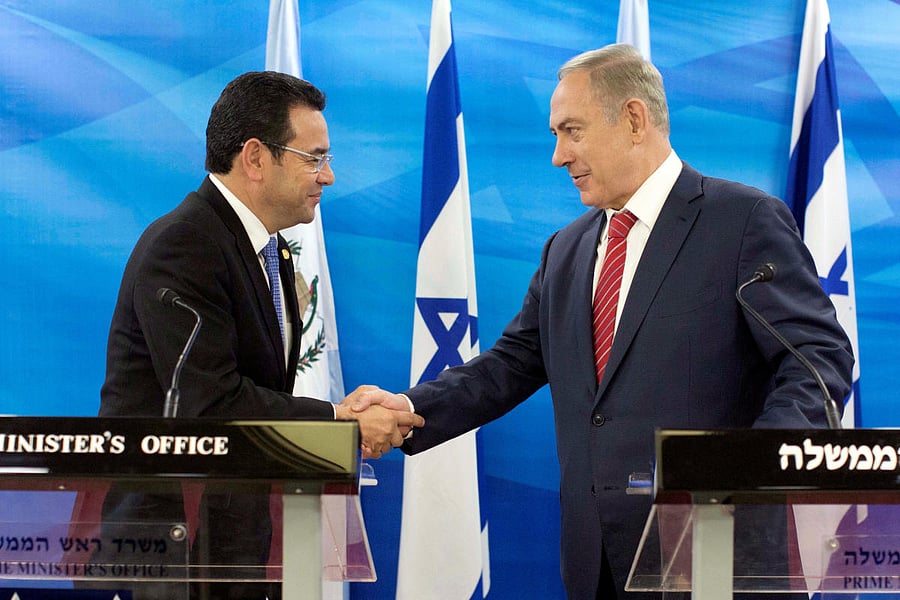 Guatemalan President Jimmy Morales (left) and Israeli Prime Minister Benjamin Netanyahu greet each other in Jerusalem. REUTERS