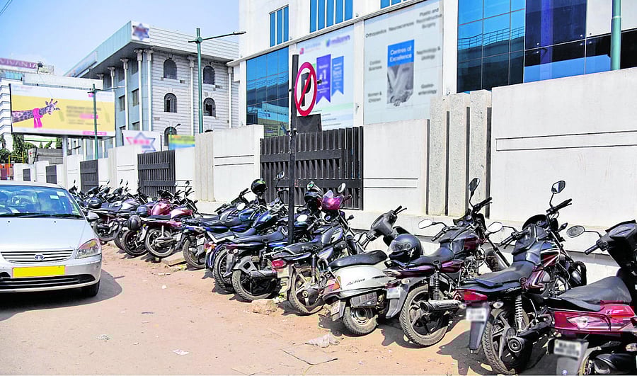 Bikes parked at a non-parking area on Tumkur Road.