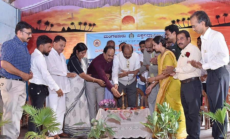 Dakshina Kannada ZP CEO Dr M R Ravi inaugurates a workshop on inland and ornamental fish culture, organised by Mangalore University, at Naringana village.