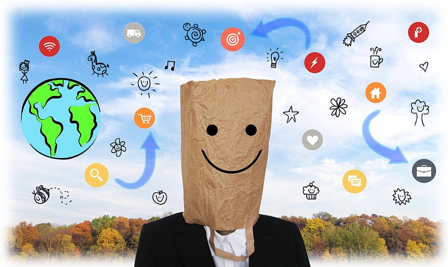 Emoji Head Woman sitting at the desk. Woman wearing a smiling face with sun glasses emoji masks while looking at her phone.This emoji is either enjoying the sun or making cool look extremely natural and easy.