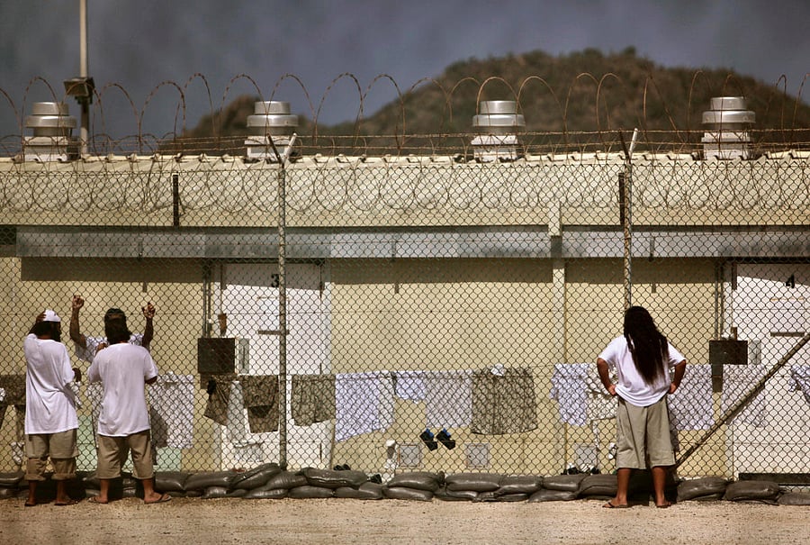 Detainees talk together inside the open-air yard at the Camp 4 detention facility at Guantanamo Bay US Naval Base in Cuba. REUTERS FILE PHOTO