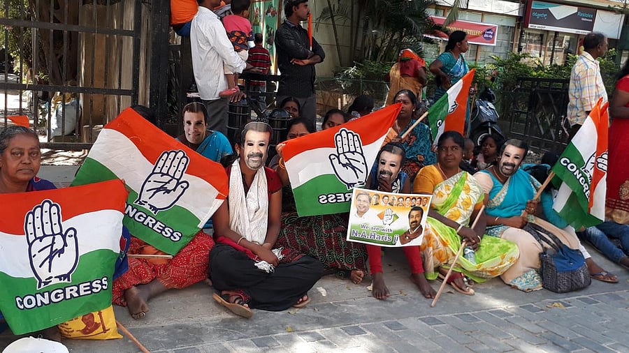 Supporters wear Haris masks and line the street on Thursday morning.