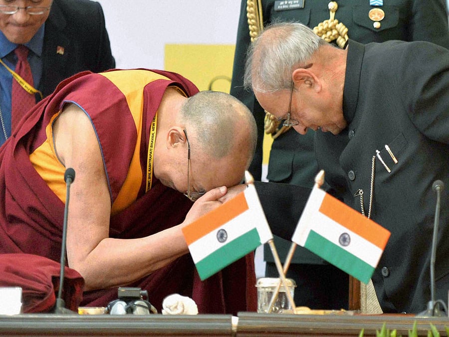 Dalai Lama with former President Pranab Mukherjee. PTI file photo.