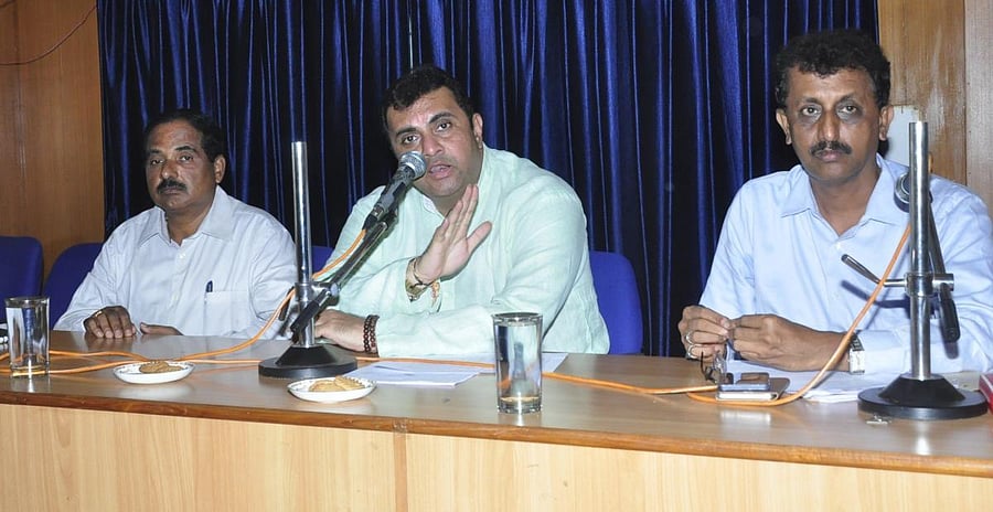 District In-charge Minister Pramod Madhwaraj chairs a meeting in Udupi on Tuesday.