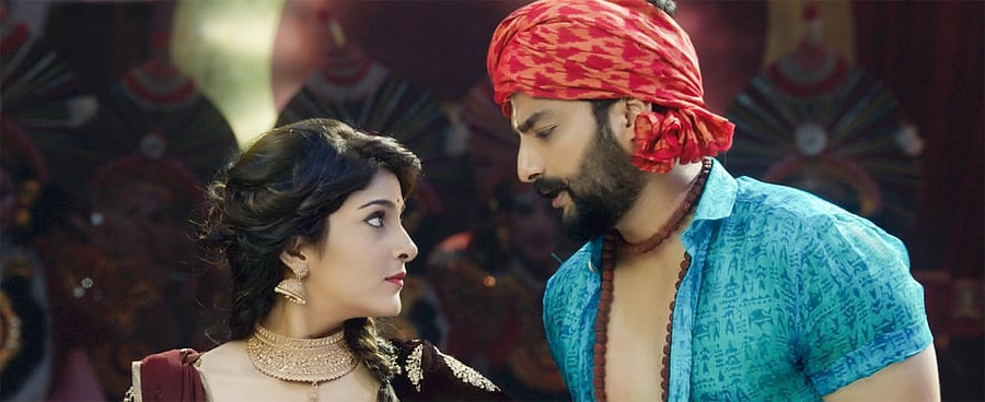 Avantika Shetty and Nirup Bhandari in a scene from 'Rajaratha'.Image courtesy: Rajaratha Team