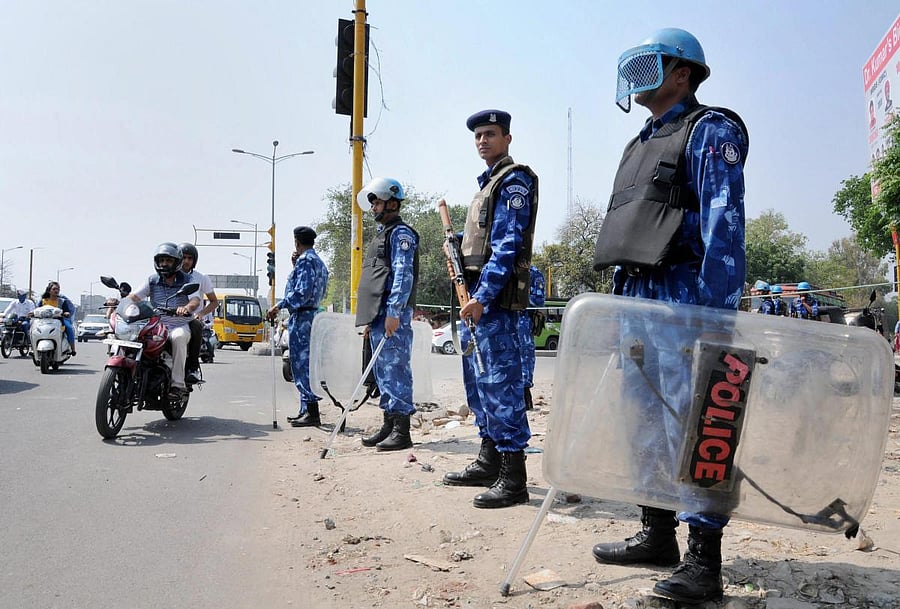 Rapid Action Force personnel stand guard in Amritsar on Sunday. PTI