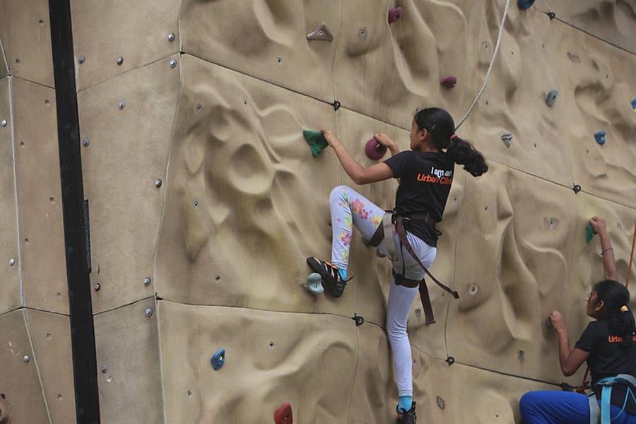 A rock climbing enthusiast at the Urban Climbers facility in Oakridge International School.