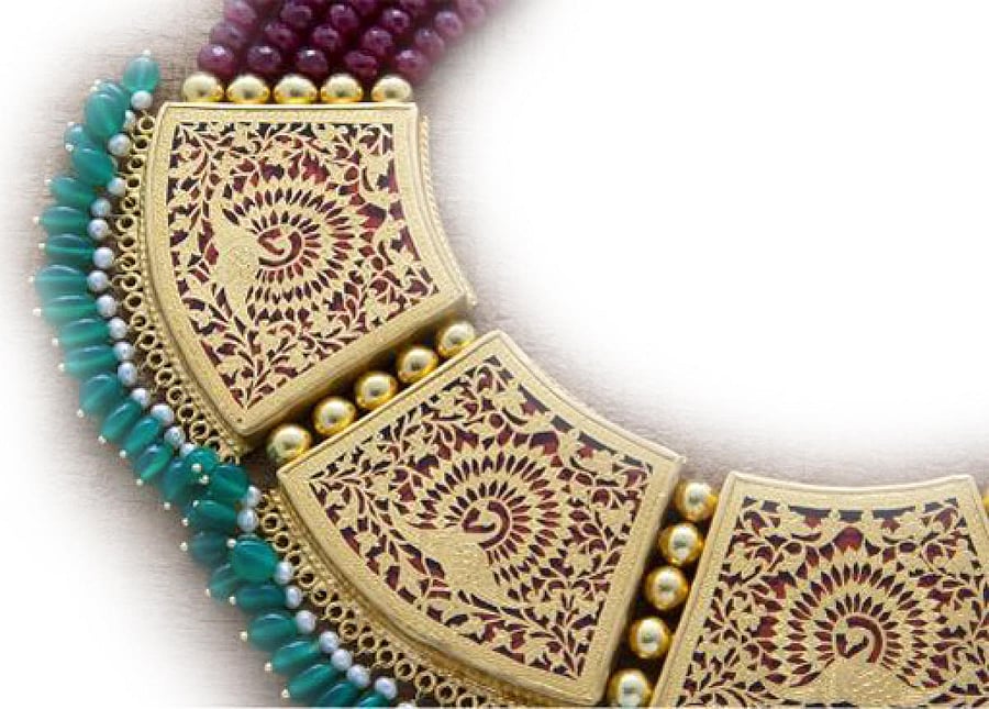 Thewa art is about setting intricate patterns on delicate gold foils.