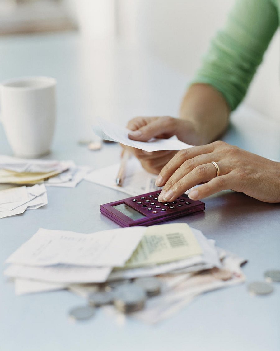 Woman Using a CalculatorWomen, finance