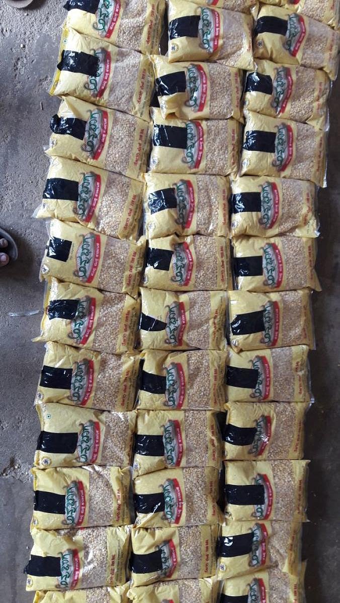 Black stickers were pasted to conceal the picture of Chief Minister Siddaramaiah printed on tur dal packets distributed under the 'Annabhagya' scheme. dh photo