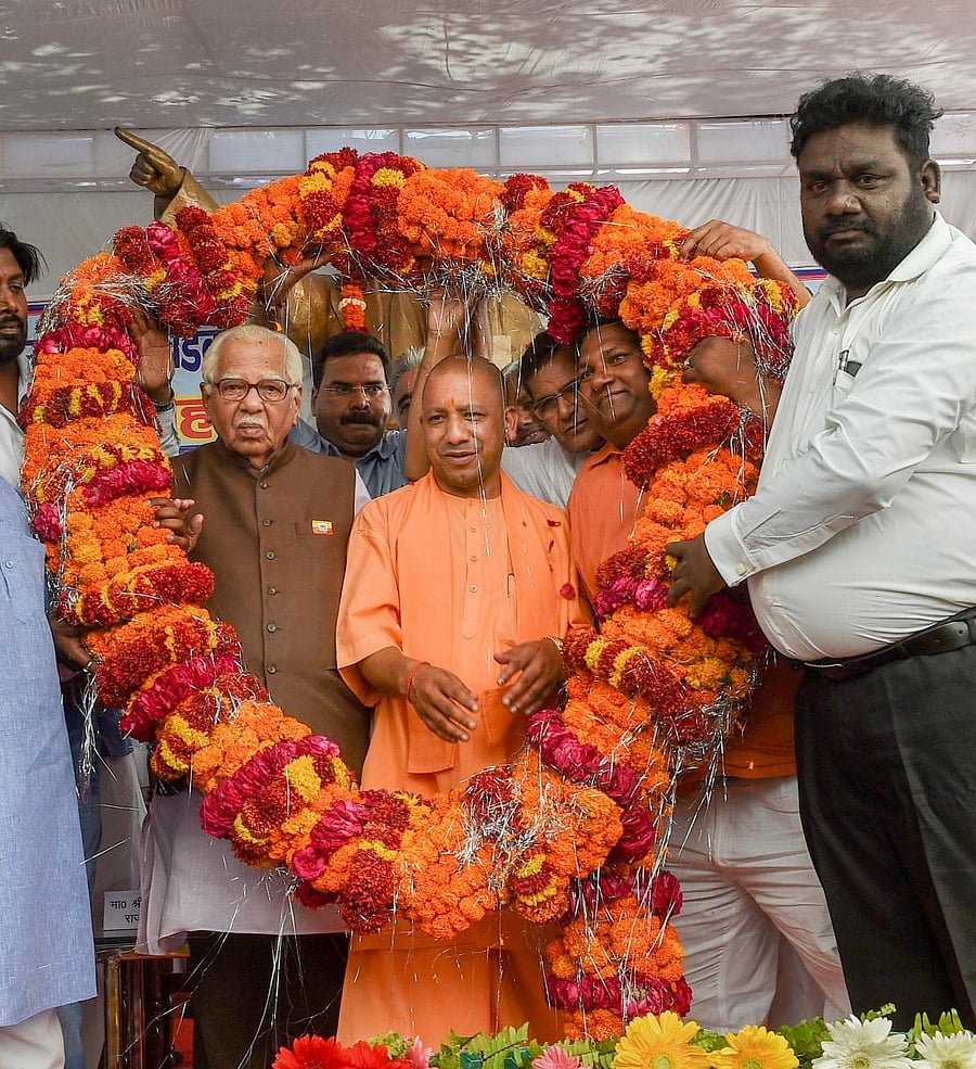 Uttar Pradesh Governor Ram Naik and Chief Minister Yogi Adityanath being garlanded at an Ambedkar Jayanti programme in Lucknow on Saturday. PTI