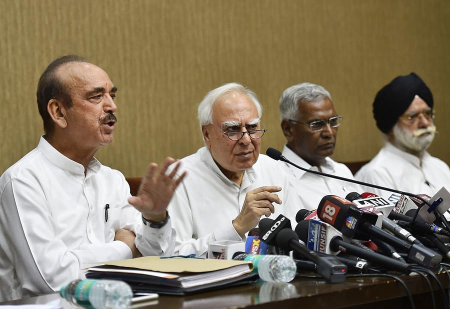 Congress leaders Ghulam Nabi Azad, Kapil Sibal, CPI's D Raja and KTS Tulsi address a press conference after opposition parties submitted a notice to the Vice President and Rajya Sabha Chairperson Venkaiah Naidu to initiate impeachment proceedings against Chief Justice of India Dipak Misra, in New Delhi on Friday. PTI Photo