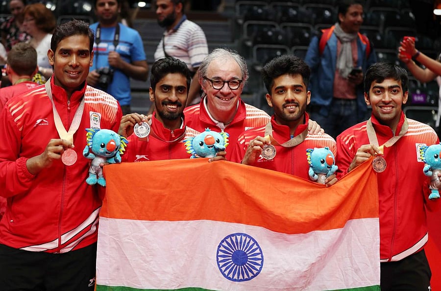 Silver medalists Sharath Achanta and Sathiyan Gnanasekaran and bronze medalists Harmeet Desai and Sanil Shankar Shetty of India celebrate. (REUTERS/Jeremy Lee)