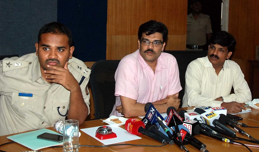 Deputy Commissioner Dr P C Jaffer, SP Rahul Kumar Shahpurawad and ZP CEO G Jagadeesha address a press meet in Hassan on Friday. dh photo