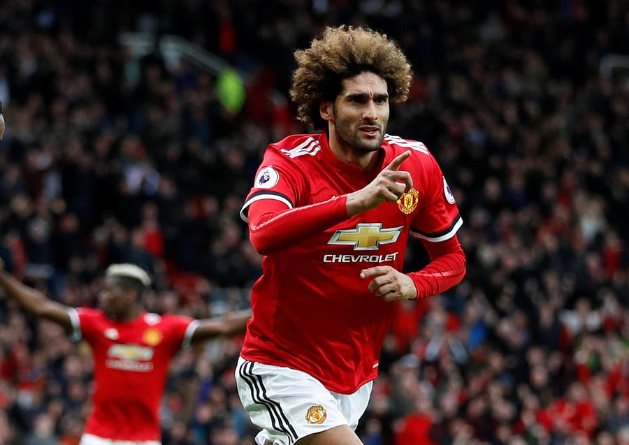 Manchester United's Marouane Fellaini celebrates after scoring the winner against Arsenal on Sunday. Reuters