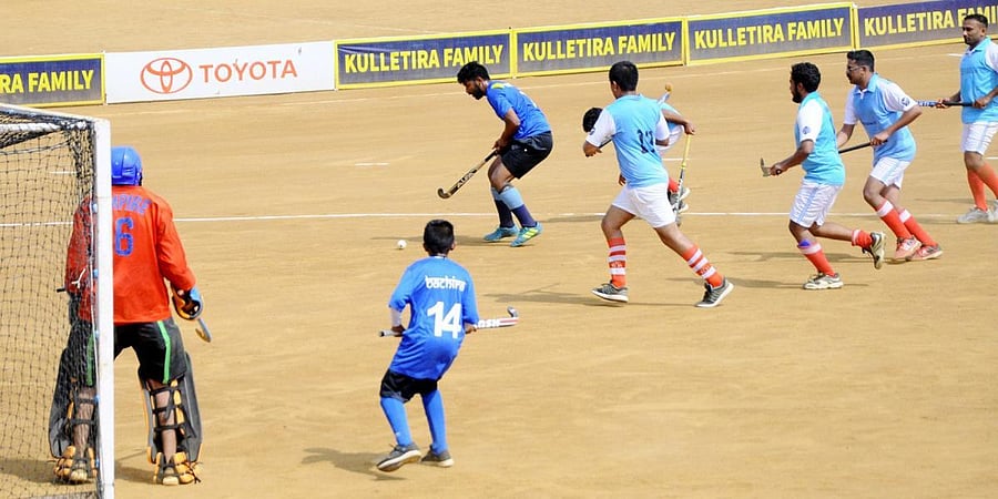 Chendrimada and Bachira teams seen in action against each other during a match in Napoklu on Thursday. DH PHOTO