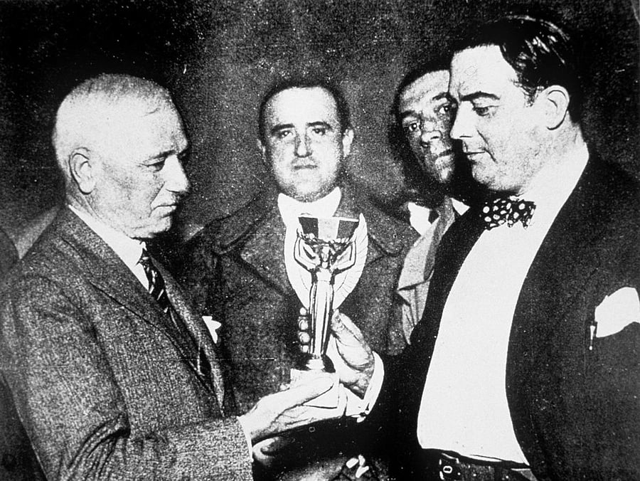 Jules Rimet (left) presents the first World Cup trophy (the Jules Rimet Trophy) to Dr Raul Jude, the president of the Uruguayan Football Association.