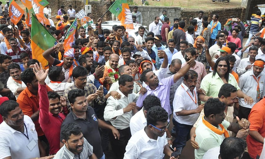 BJP workers celebrate the victory of Raghupathi Bhat in Udupi on Tuesday.