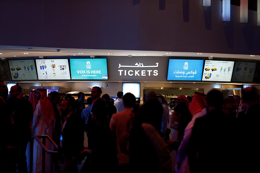 Saudi people gather at the ticket counter during the opening of a cinema at Riyadh Park mall in Riyadh. Reuters file photo