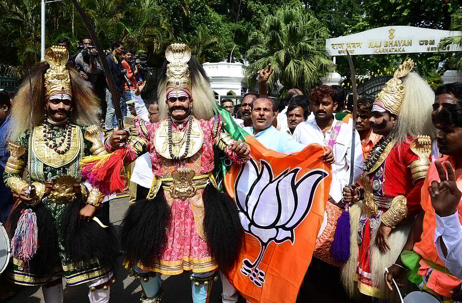 BJP workers along with folk artistes celebrate as B S Yeddyurappa takes oath as chief minister. DH Photo