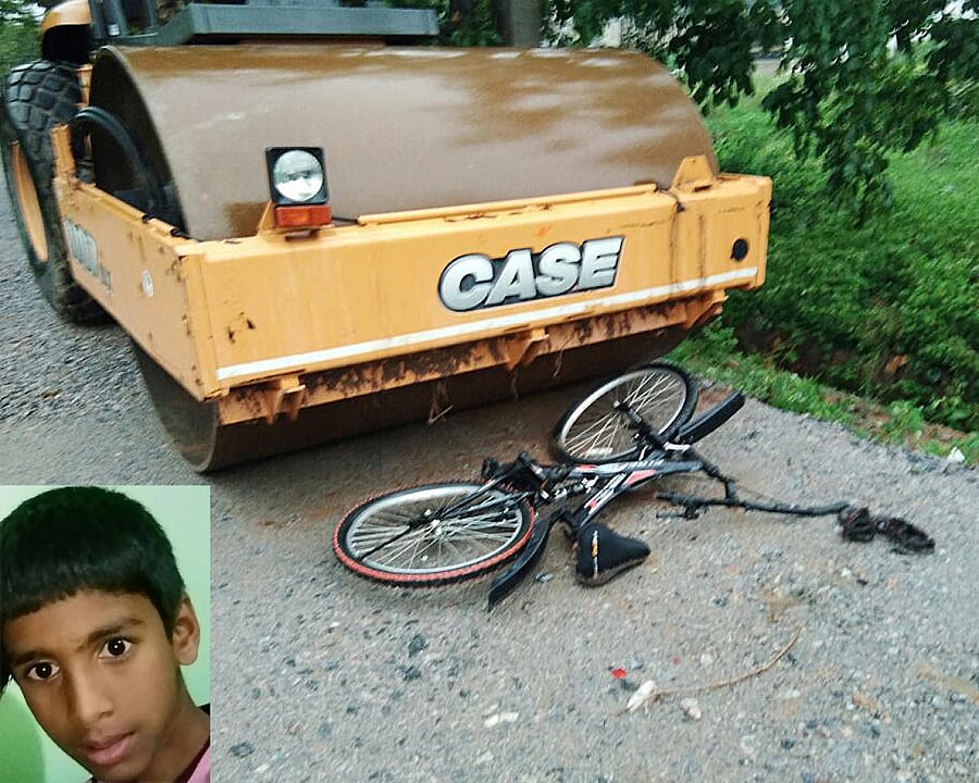 The road roller that crushed Manu R (inset) at Thalaghattapura Layout in Hemmigepura on Friday. His bicycle is seen lying on the road.