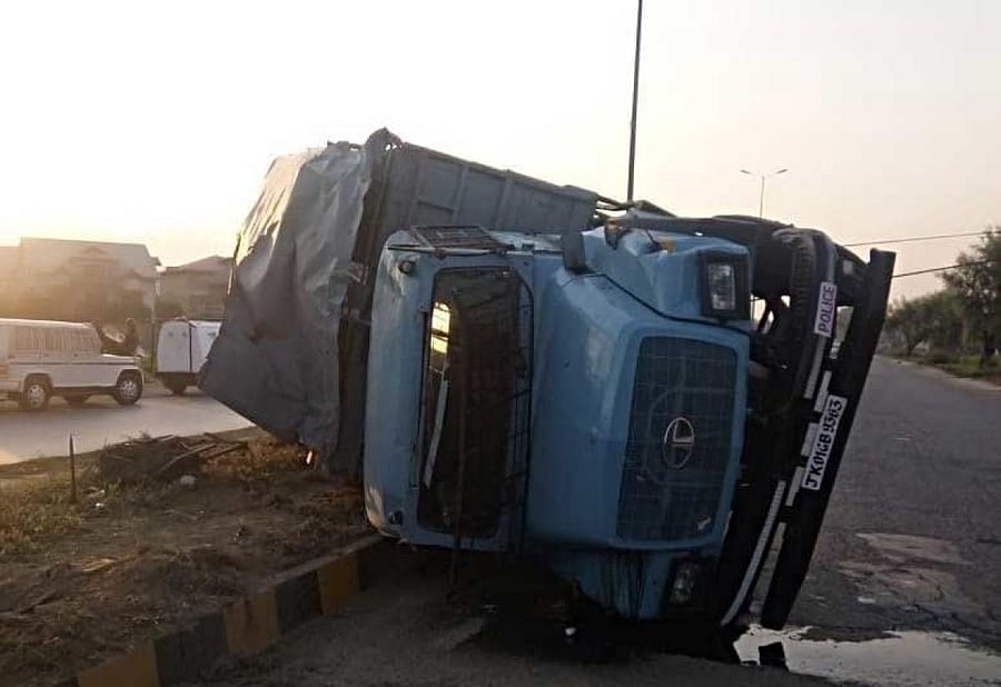 A CRPF vehicle turned turtle after its driver lost control near the Bemina headquarter of the paramilitary force, a police official said. Image Courtesy: ANI/Twitter