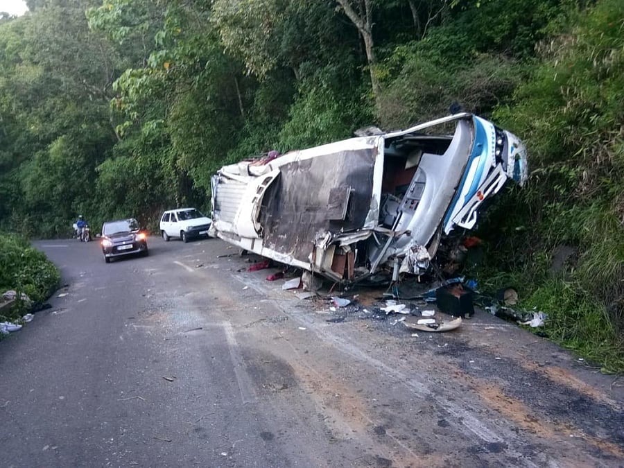 The mangled remains of the tourist bus that hit a boulder, near Gudalur in Tamil Nadu, on Saturday night.