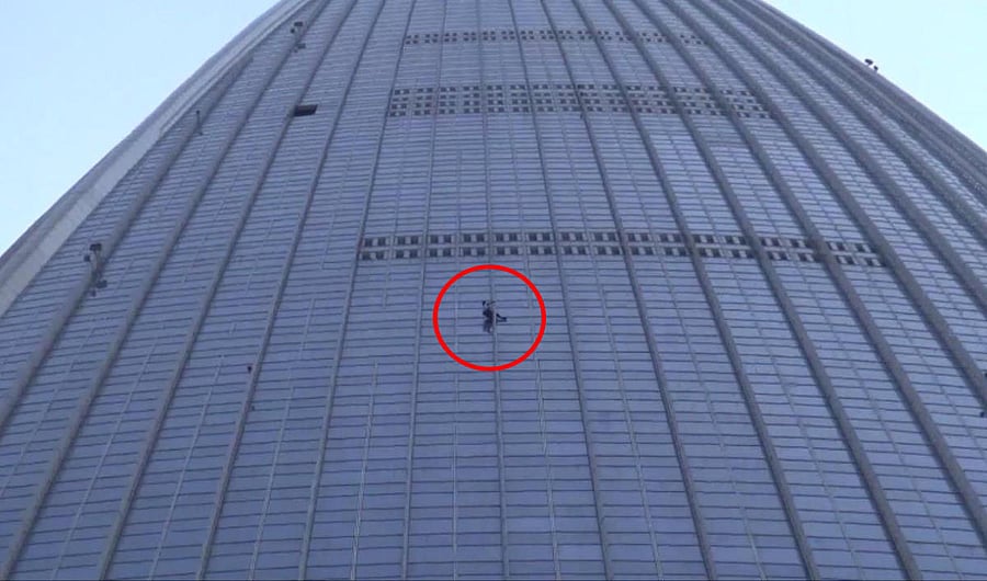 French climber Alain Robert, also known as "The French Spiderman", climbs the exterior of the Lotte World Tower in Seoul, South Korea, June 6, 2018. Yonhap via REUTERS.