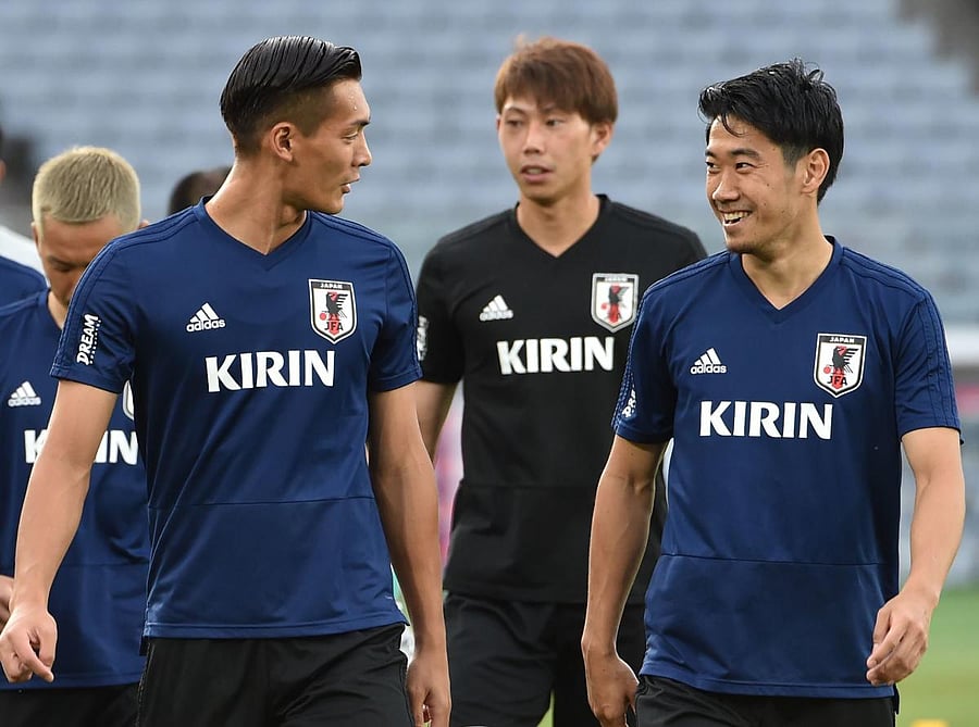 Shinji Kagawa (right), who has rediscovered his form of old, will be the man Japan will be pinning most of their hopes on at the World Cup. AFP
