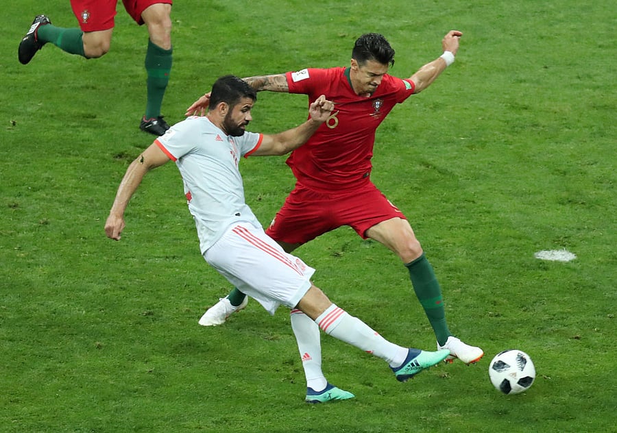 Spain's forward Diego Costa scores a goal during the Russia 2018 World Cup Group B football match between Portugal and Spain at the Fisht Stadium in Sochi on June 15, 2018. AFP PHOTO