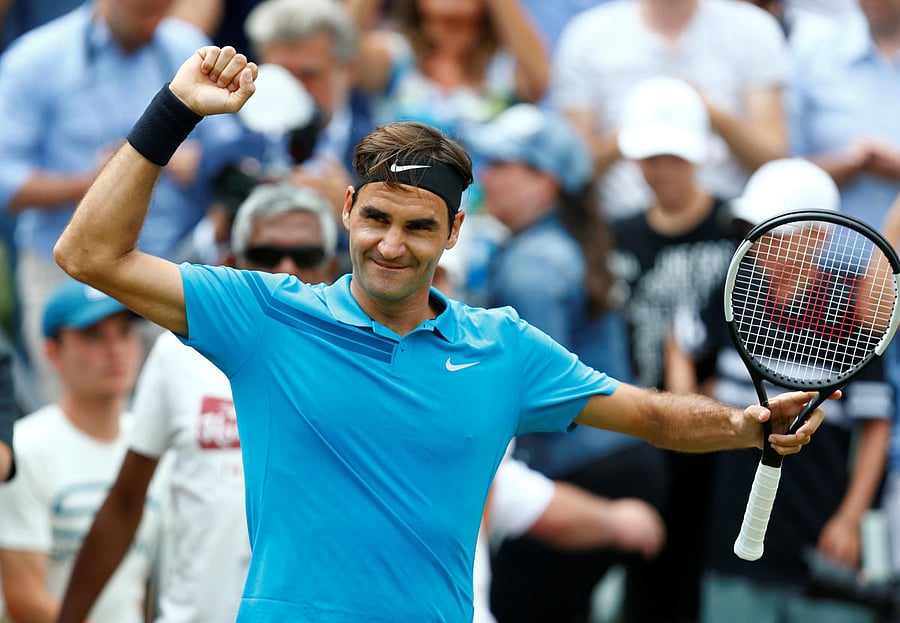 Roger Federer celebrates winning the final against Canada's Milos Raonic. Reuters photo