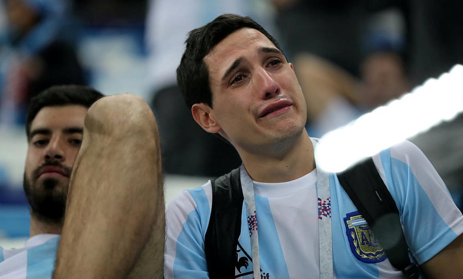 Argentina fan looks dejected after the match. (REUTERS/Ivan Alvarado)