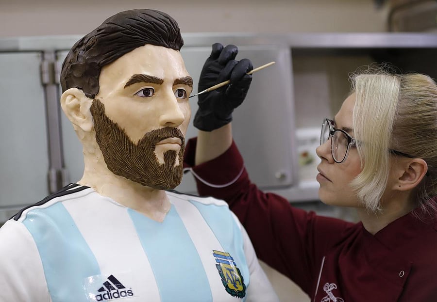 An employee of Altufyevo Confectionery finishes the preparation of a life-size chocolate sculpture of Argentine soccer player Lionel Messi. REUTERS