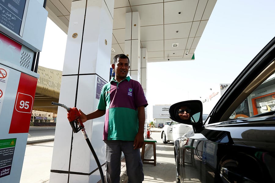 Majdooleen, who is among the first Saudi women allowed to drive in Saudi Arabia refuels her car as she going to work in Riyadh, Saudi Arabia on Sunday. REUTERS