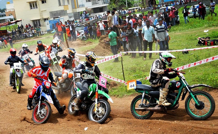 Participants take part in a dirt race on the bypass at Chikkamagaluru on Sunday.