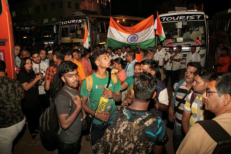 Devotees board buses, as the first batch of pilgrims leaves for Amarnath Yatra, in Jammu on Wednesday, June 27, 2018. PTI Photo