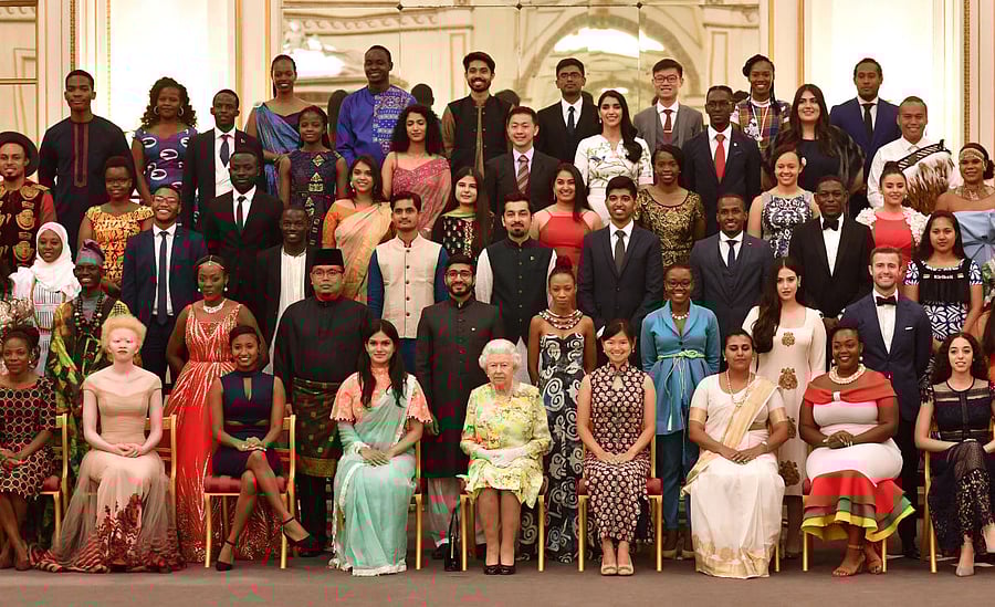 Britain's Queen Elizabeth poses for a picture with some of Queen's Young Leaders at a Buckingham Palace reception following the final Queen's Young Leaders Awards Ceremony, in London, Britain. Reuters Photo