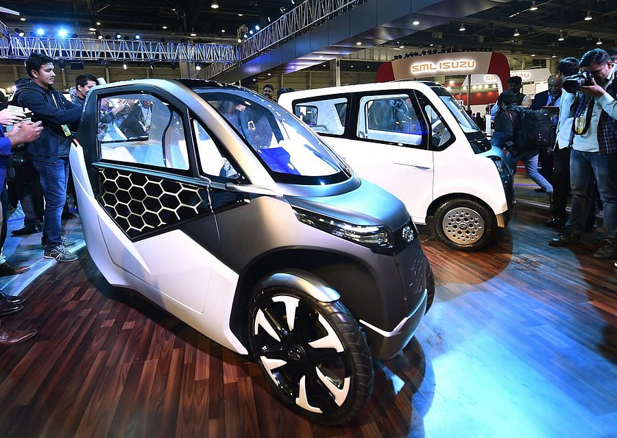 Greater Noida: Mahindra & Mahindra's electric vehicles on display at the company's stall Auto Expo 2018 in Greater Noida, Uttar Pradesh on Wednesday. PTI Photo by Kamal Singh (PTI2_7_2018_000207A)