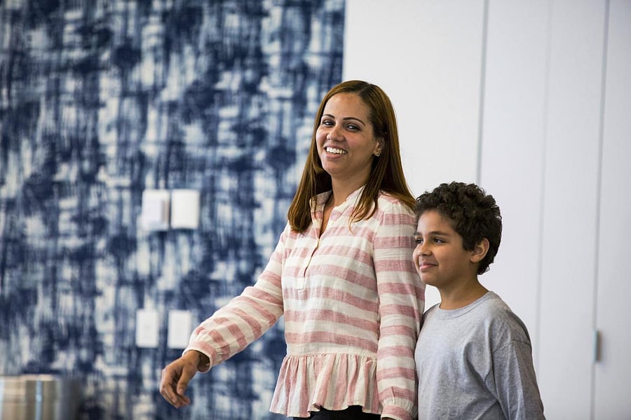 Lidia Karine Souza and her son Diogo De Olivera Filho enter a press conference at the Mayer Brown law firm during a news conference after Diogo was reunited with his mother. AP/PTI file photo