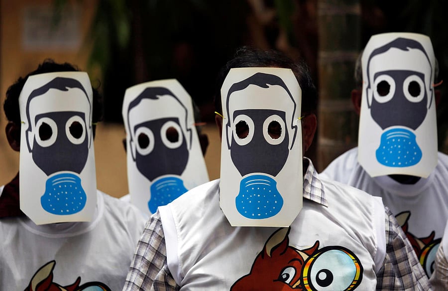 People protest against pollution by wearing cutouts of gas masks on World Environment Day in Mumbai, India, June 5, 2018. Reuters photo for representation. 