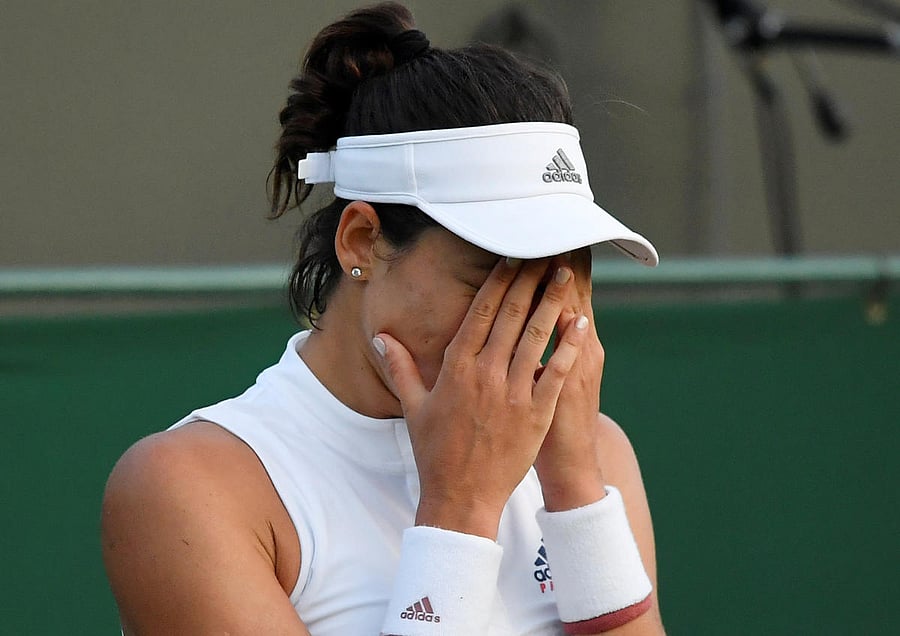 UPSET: Spain's Garbine Muguruza reacts during her second round Wimbledon match against Belgium's Alison Van Uytvanck. REUTERS