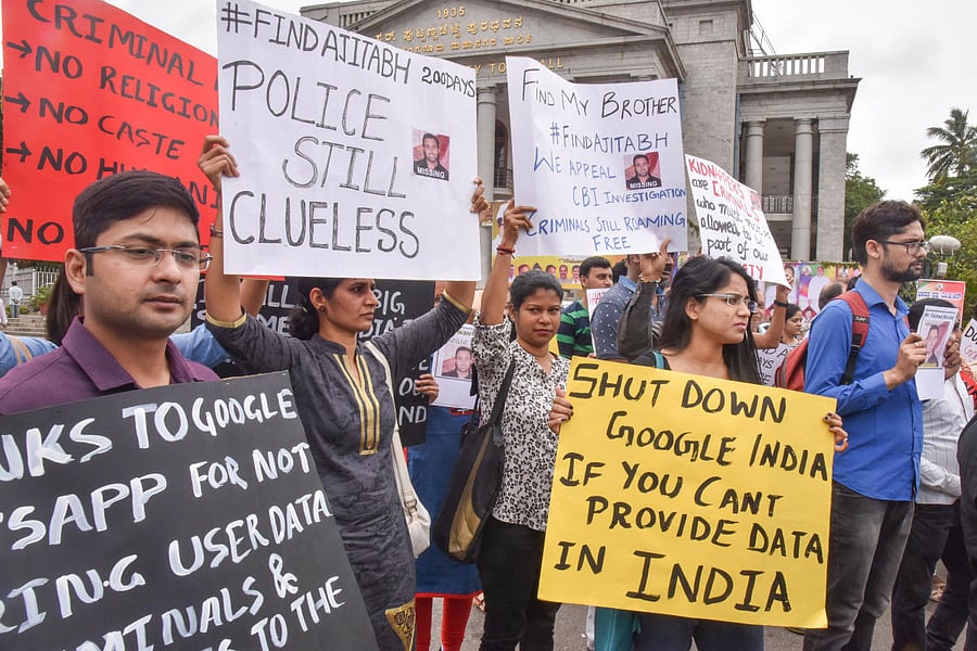 Pain and anguish: Relatives, friends and colleagues of Kumar Ajitabh protest outside the Town Hall on Sunday, demanding a quick investigation into his disappearance. DH PHOTO/S K DINESH