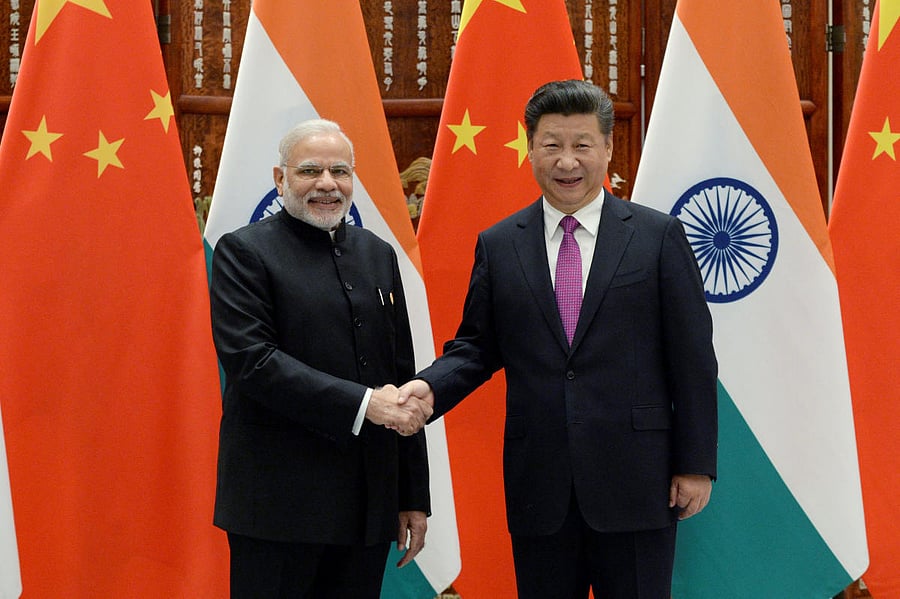 Indian Prime Minister Narendra Modi (L) shakes hands with Chinese President Xi Jinping. REUTERS File Photo.