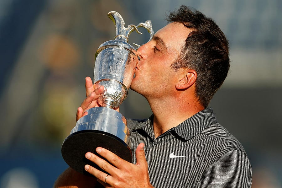 SWEET SUCCESS: Francesco Molinari celebrates with the Claret Jug after winning the 147th Open Championship. Reuters