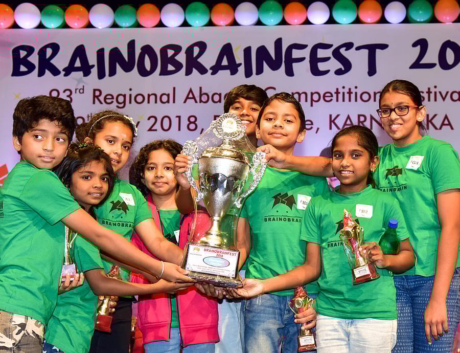 Children from Brainobrain, Rajajinagar, who won the overall trophy at the mental arithmetic calibre competition on Sunday. DH PHOTO/ B H Shivakumar