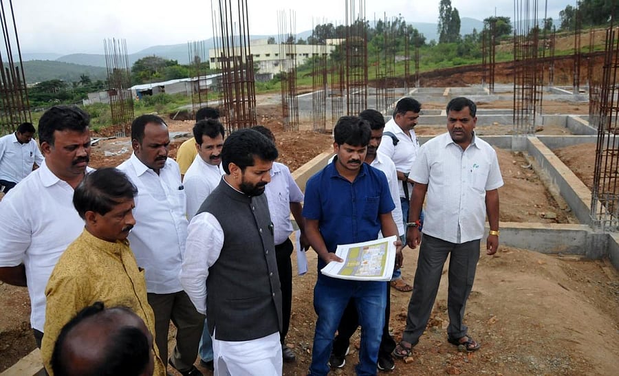 MLA C T Ravi reviews the construction work on the District Administration Complex in Chikkamagaluru on Monday.