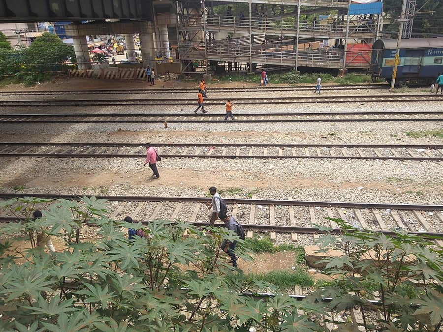 Getting to Whitefield Railway Station is a nightmare for commuters as there is only one entrance to the station in the North side. Commuters heading from South should choose between climbing walls or cross the railway tracks to reach the main entrance in South. 