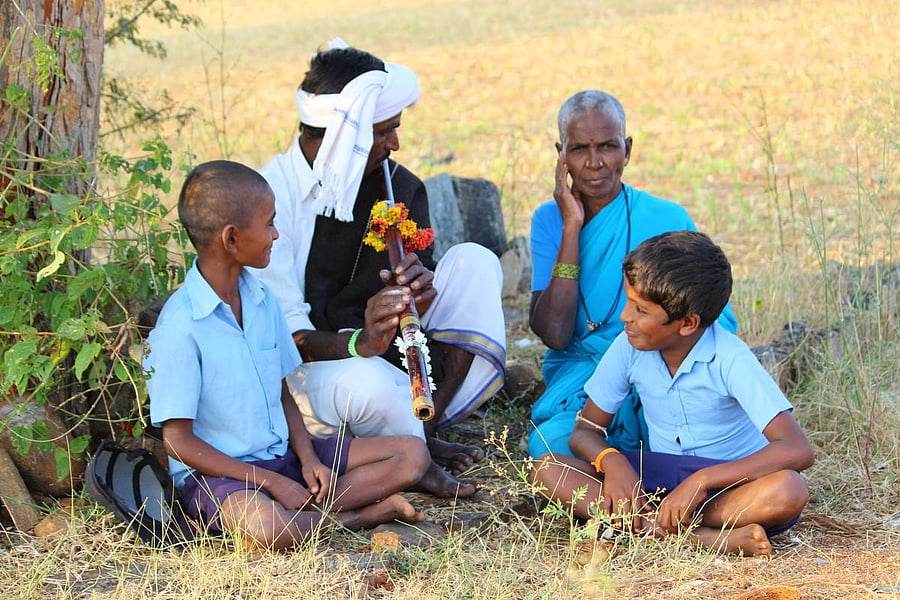 Folk Music Ramanna, a Ganey artiste, playing the instrument; (below) Ramanna holding the Ganey. photos by author