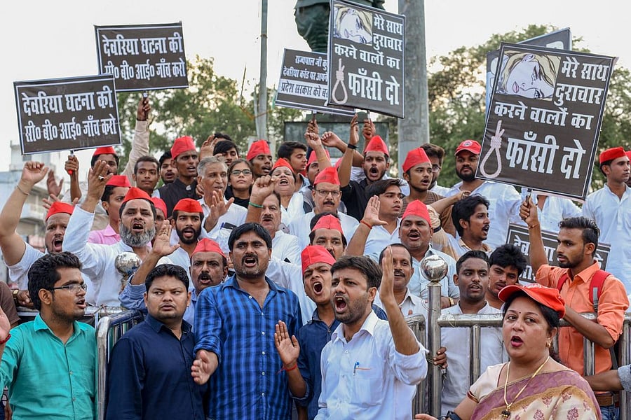 Samajwadi Party activists display placards and raise slogans against Uttar Pradesh Chief Minister Yogi Adityanath during a protest over the recent Deoria shelter home incident, in Allahabad. PTI photo